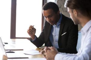 A professional helps his client understand Pegasus Legal Capital vs. Thrivest Link Legal Funding: Which is right for you?