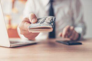 Businessman offering cash money. How much pre-settlement funding can I get?