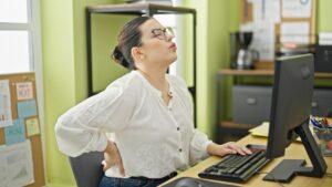 An injured woman uses a computer to check Uplift Legal Funding online reviews.
